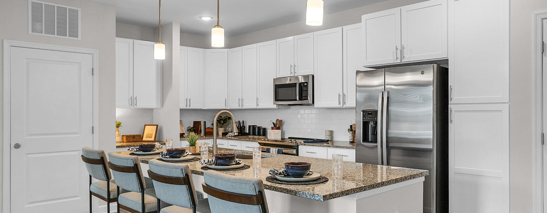 a kitchen with white cabinets