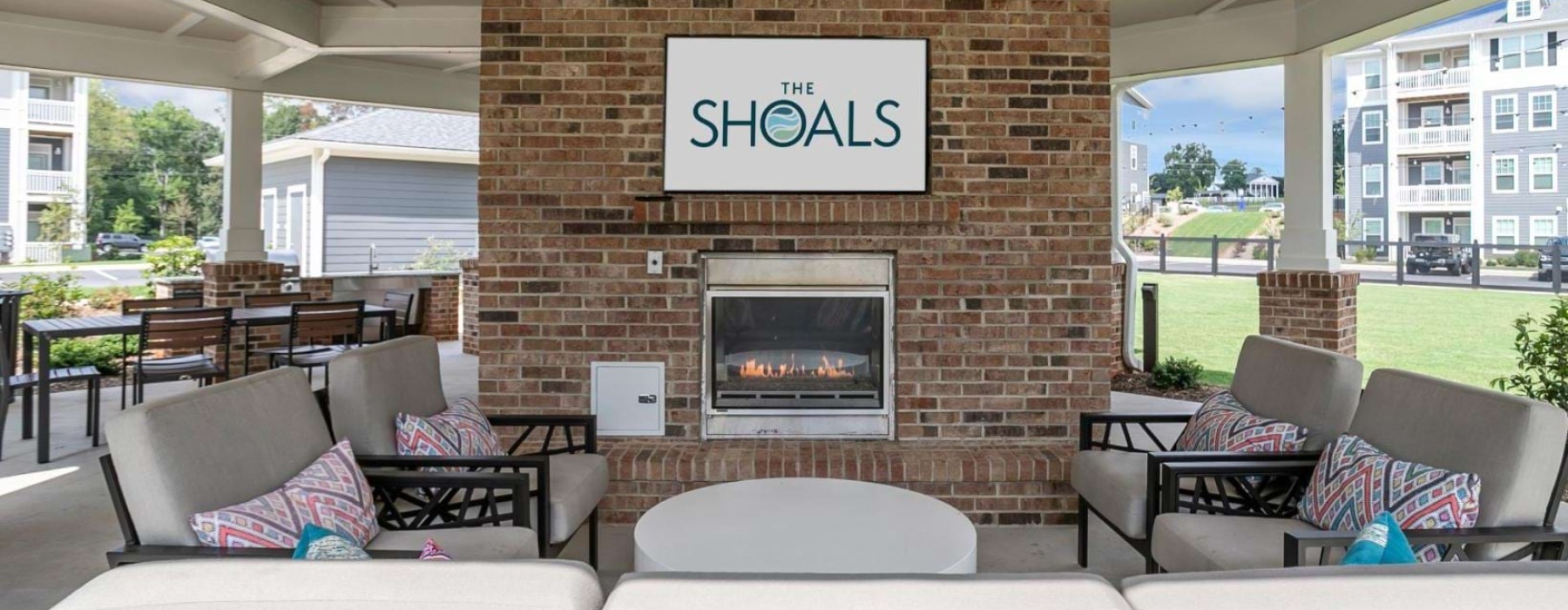 a room with a fireplace and chairs